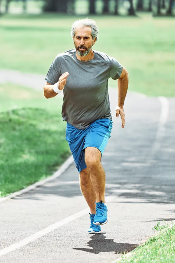 ACL-Tears-Treatment A man running on a track. Get treatment for ACL tears from Lux Hormones & Health Wellness in San Diego.