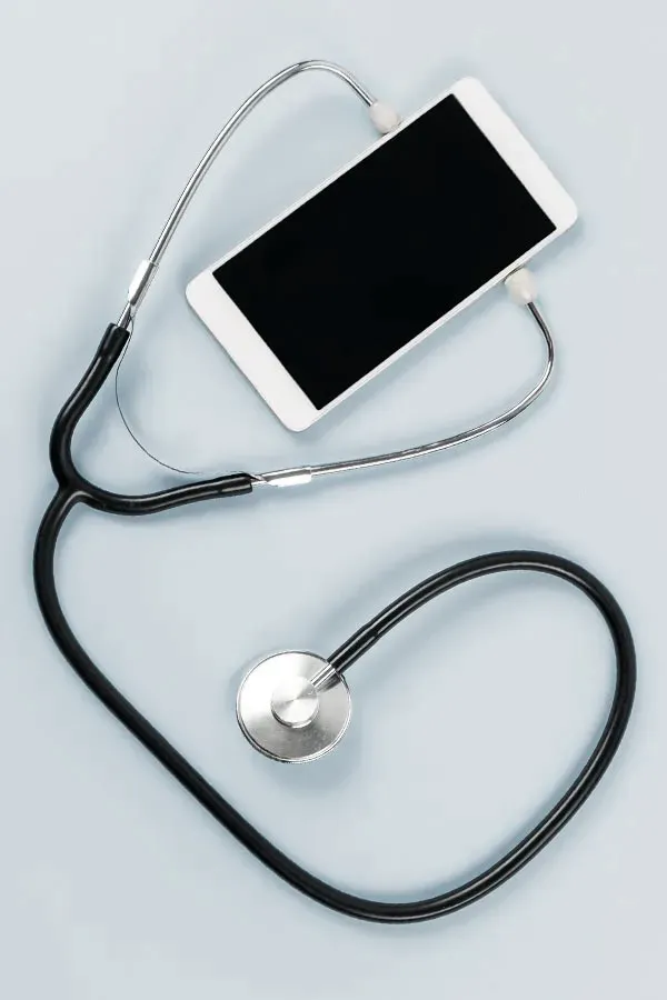 Telemedicine-Treatment A smartphone with a stethoscope attached to it, symbolizing Telemedicine treatment from Lux Hormones & Health Wellness in San Diego.